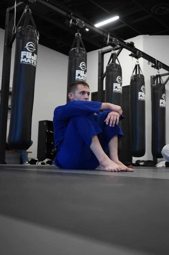 Professor London Horn in a blue gi and black belt at the academy