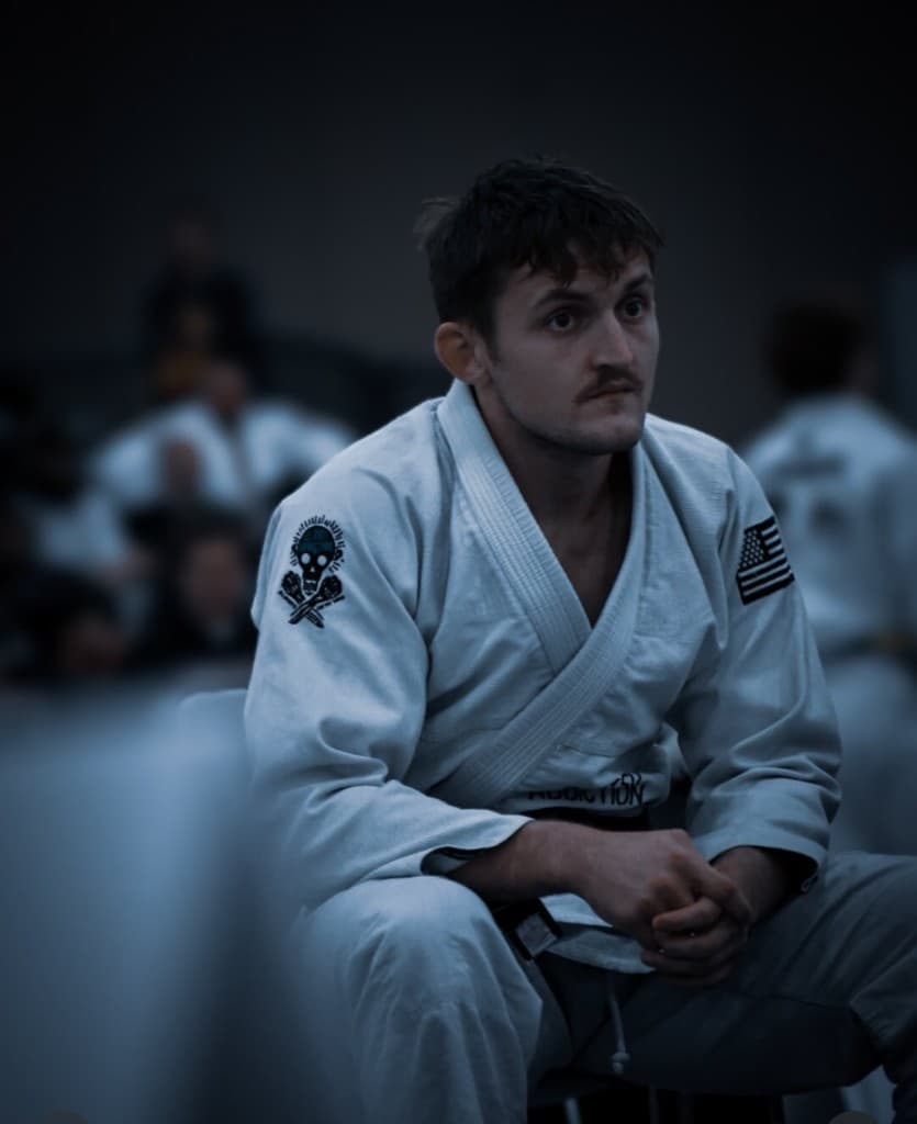 Professor London Horn focused between matches in a white gi